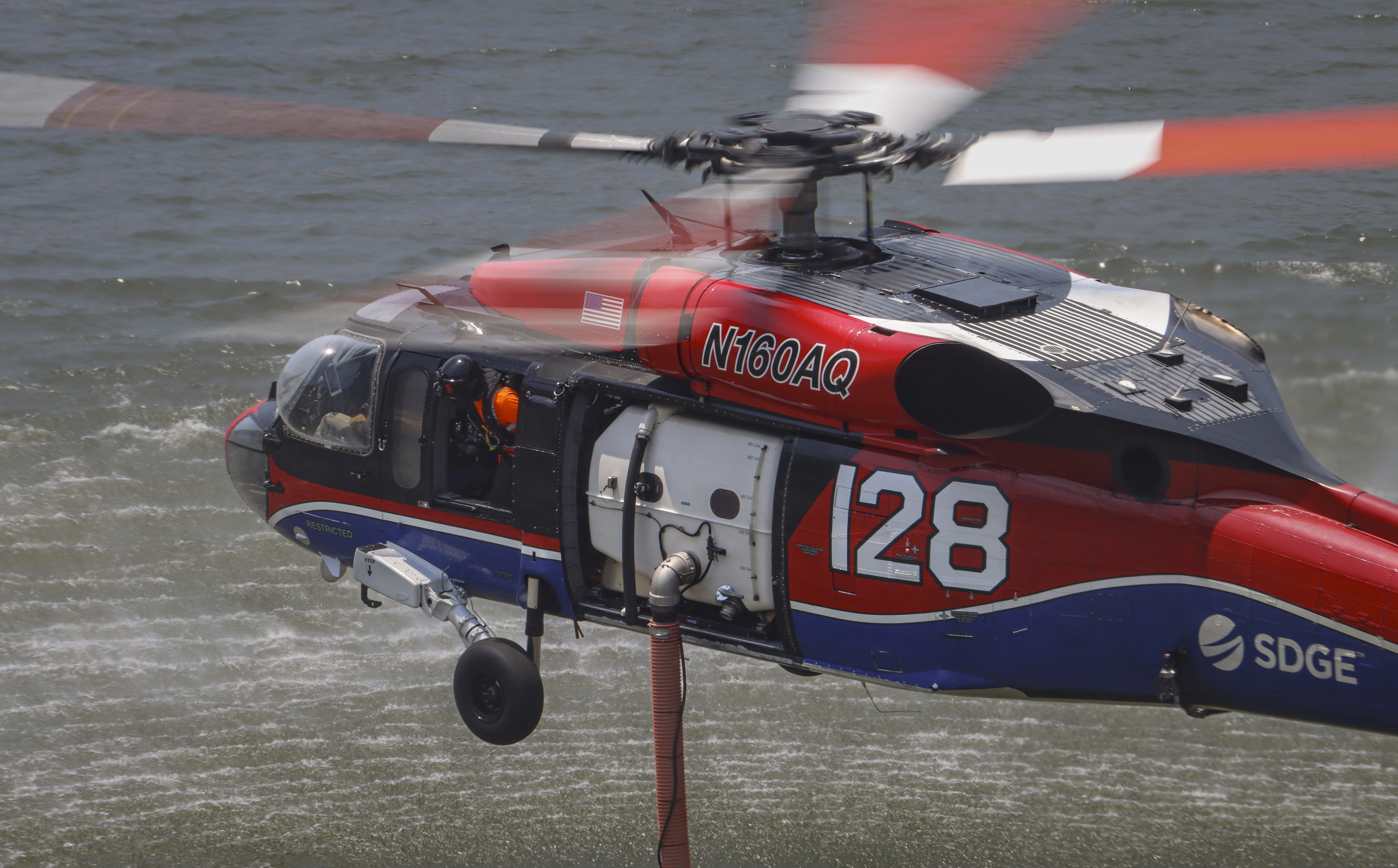 Copter 128 filling up at the El Capitan dip while supporting other firefighting agencies on containing a large vegetation fire in Lakeside, CA dubbed the Monte Fire.