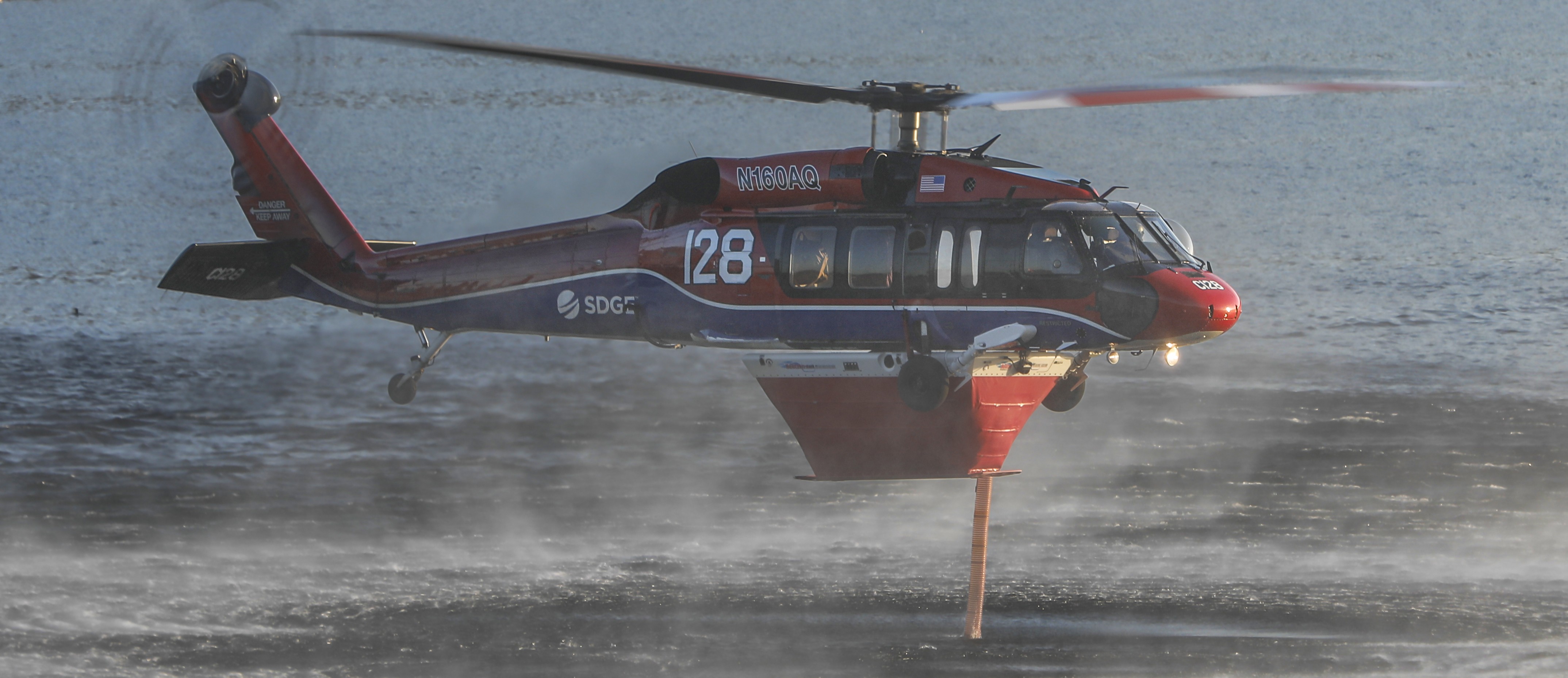 Copter 128, filling up on water from the Lower Otay Lakes in Chula Vista, CA while supporting aerial firefighting operations during the Border 18 Fire in the Otay Mountains of San Diego County.