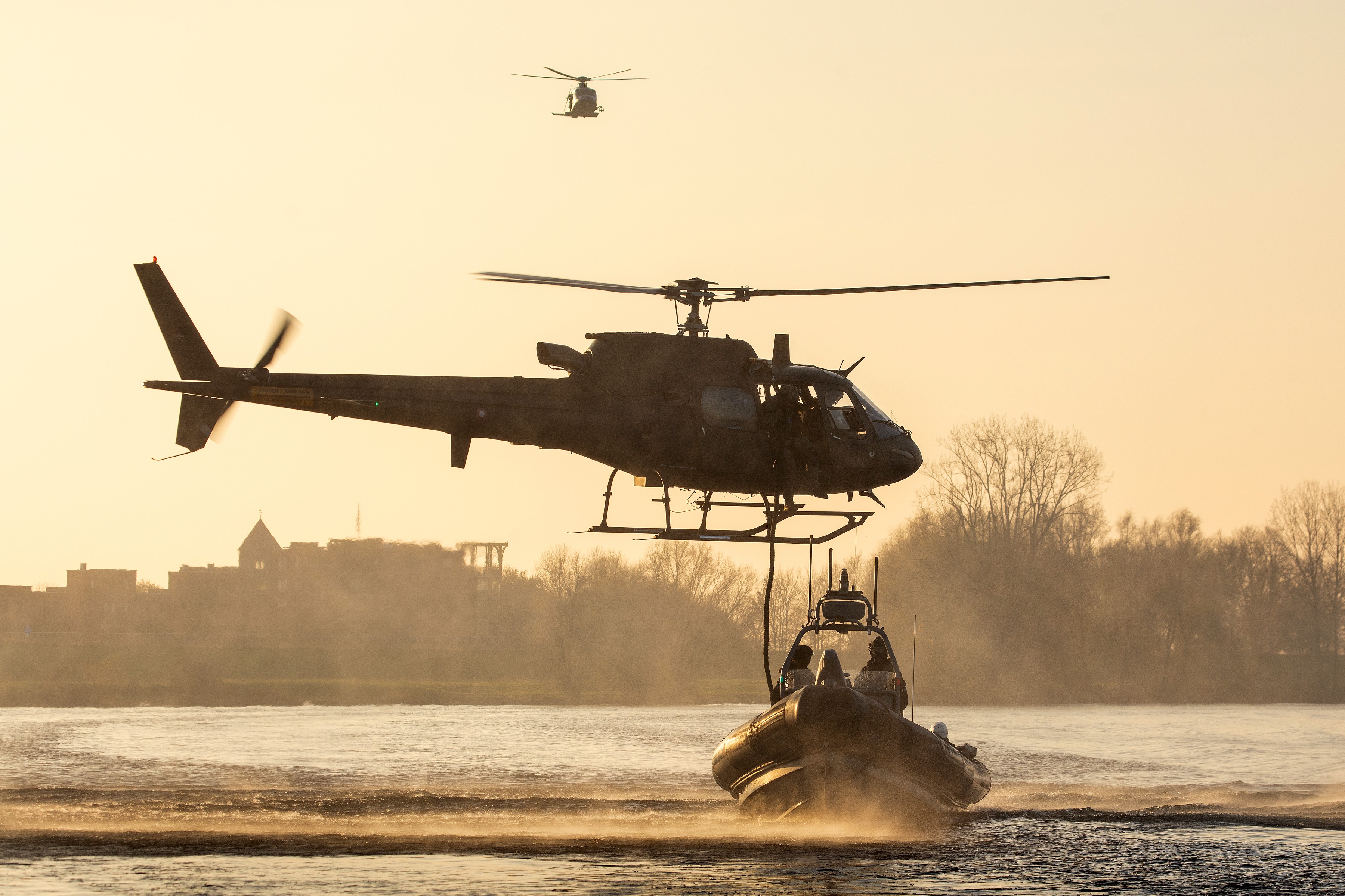 Danish Fennec working with SOF boats during exercise with Dutch police. During this exercise troops did fastroping from the helicopter into the boats, with low or high speeds.