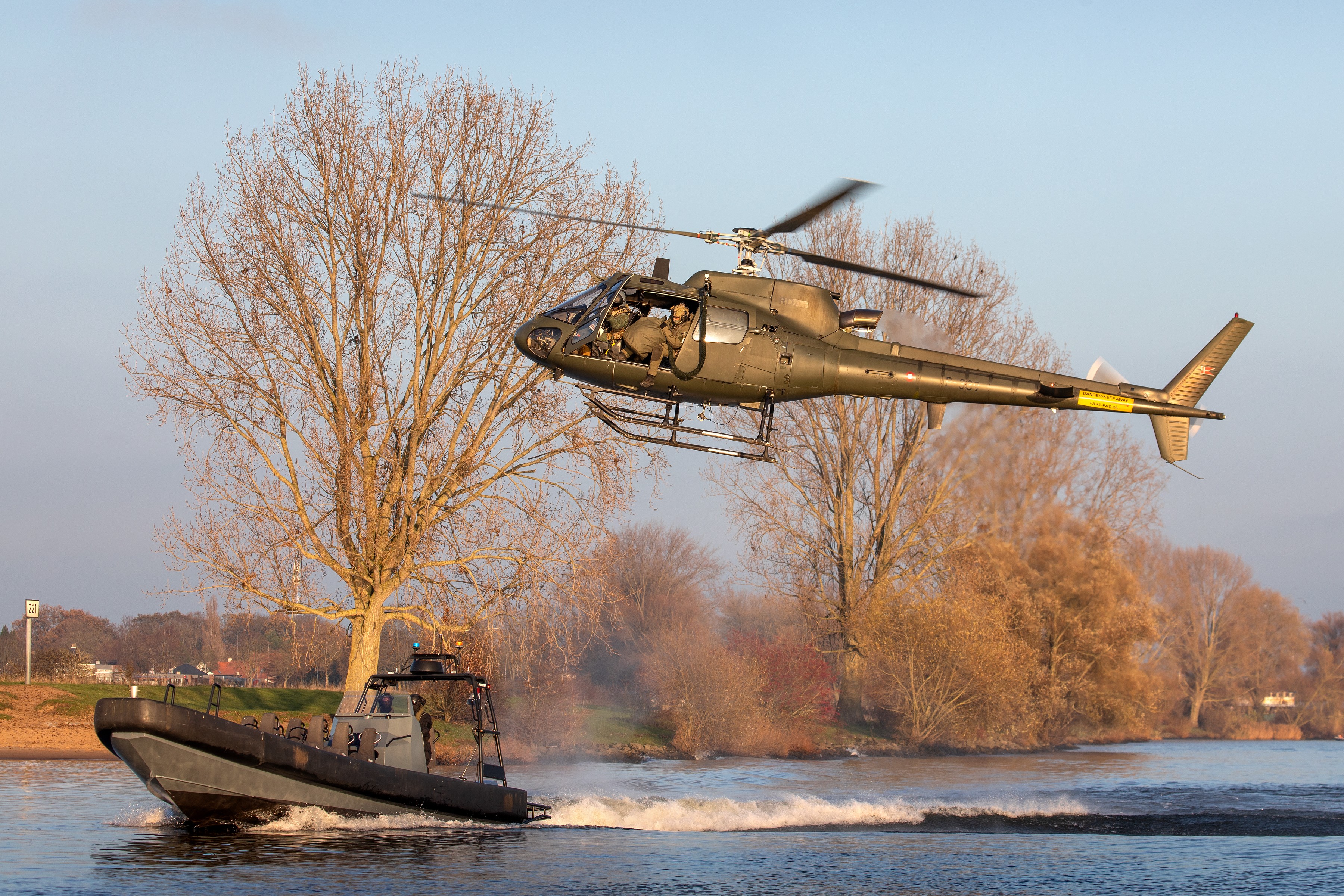 Danish Fennec working with SOF boats during exercise with Dutch police. During this exercise troops did fastroping from the helicopter into the boats, with low or high speeds.