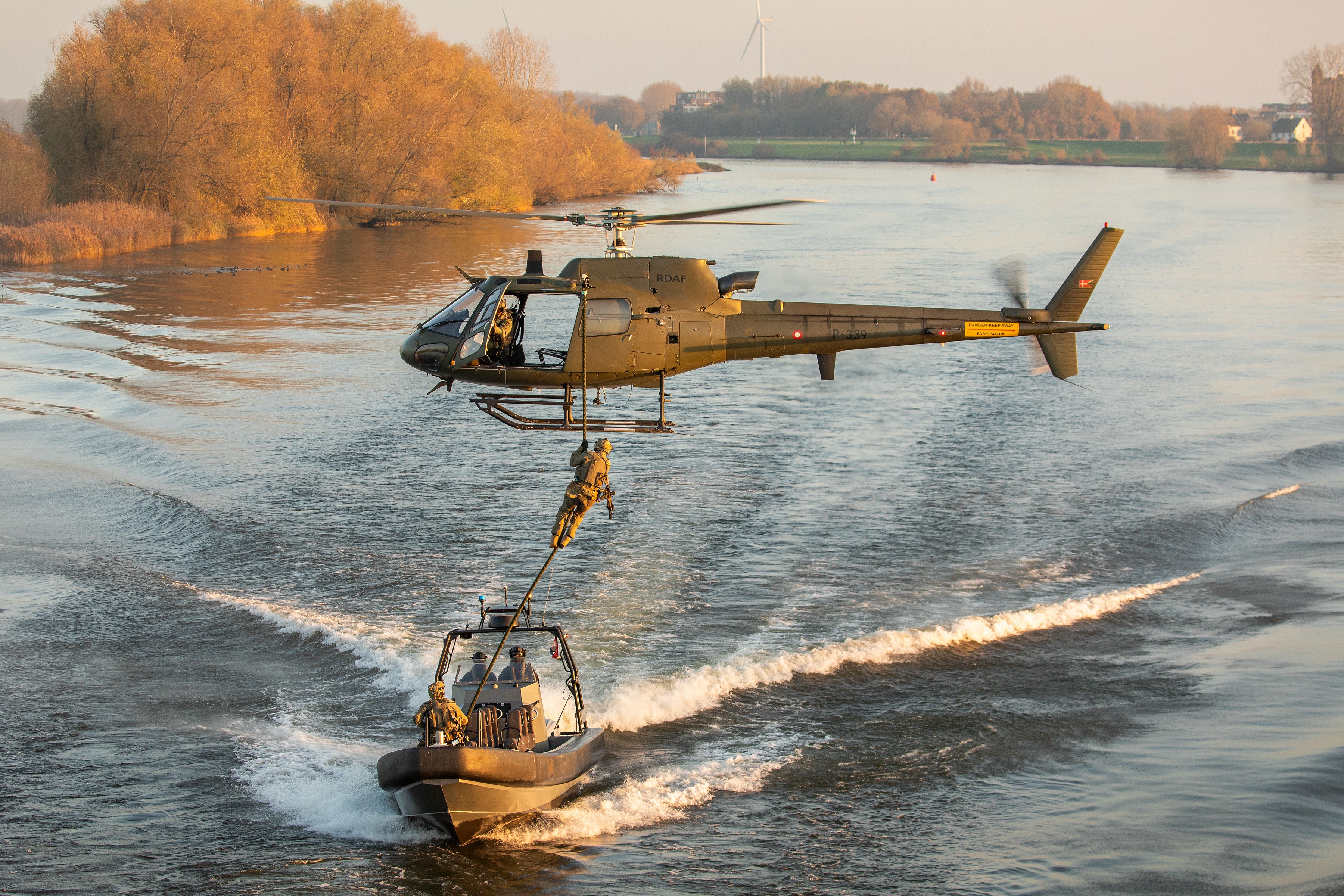 Danish Fennec working with SOF boats during exercise with Dutch police. During this exercise troops did fastroping from the helicopter into the boats, with low or high speeds.