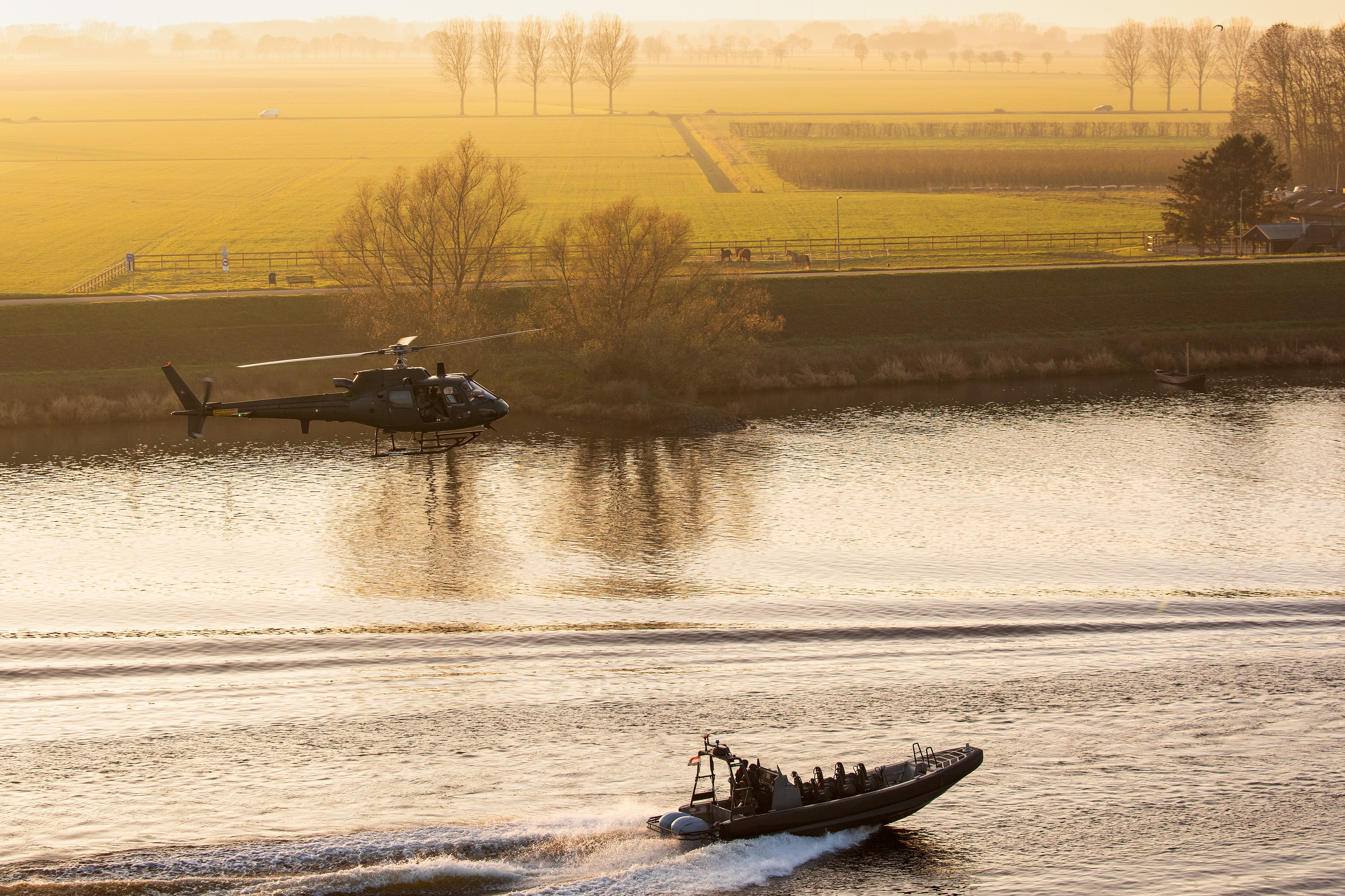 Danish Fennec working with SOF boats during exercise with Dutch police. During this exercise troops did fastroping from the helicopter into the boats, with low or high speeds.