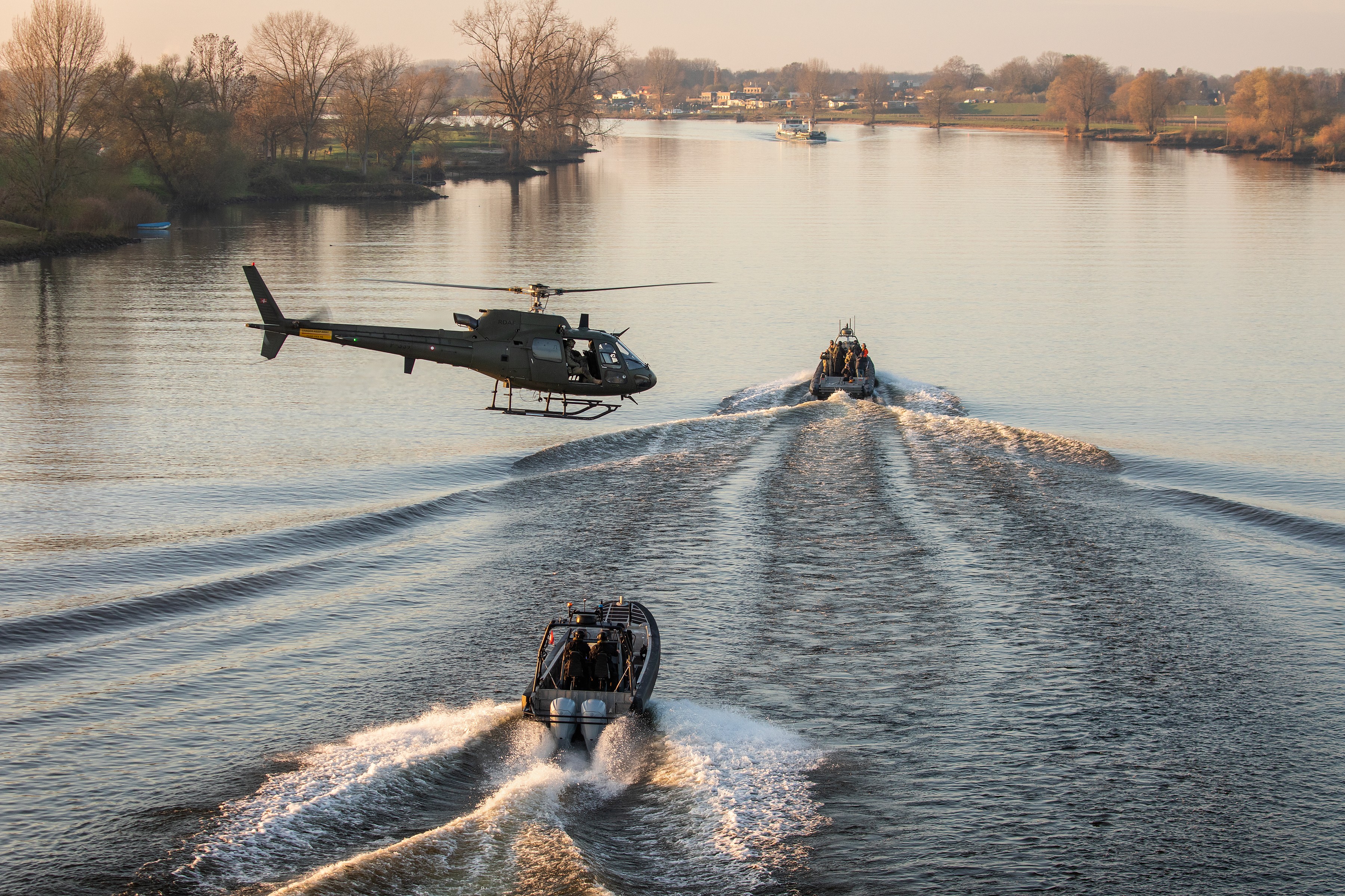 Danish Fennec working with SOF boats during exercise with Dutch police. During this exercise troops did fastroping from the helicopter into the boats, with low or high speeds.