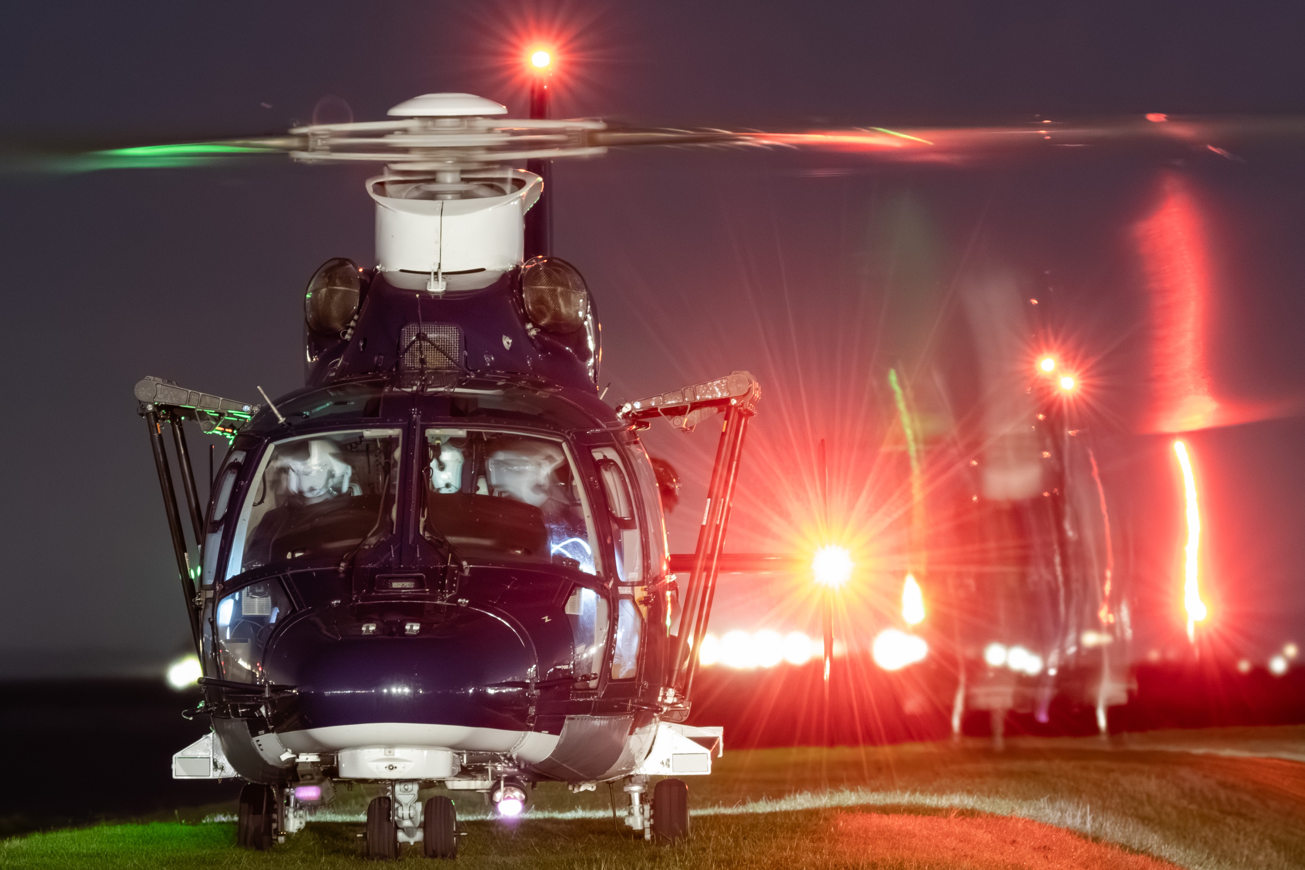 A pair of AS365N3 Dauphins operated by 658 Squadron Army Air Corps departing a remote location at night following a troop extraction.
