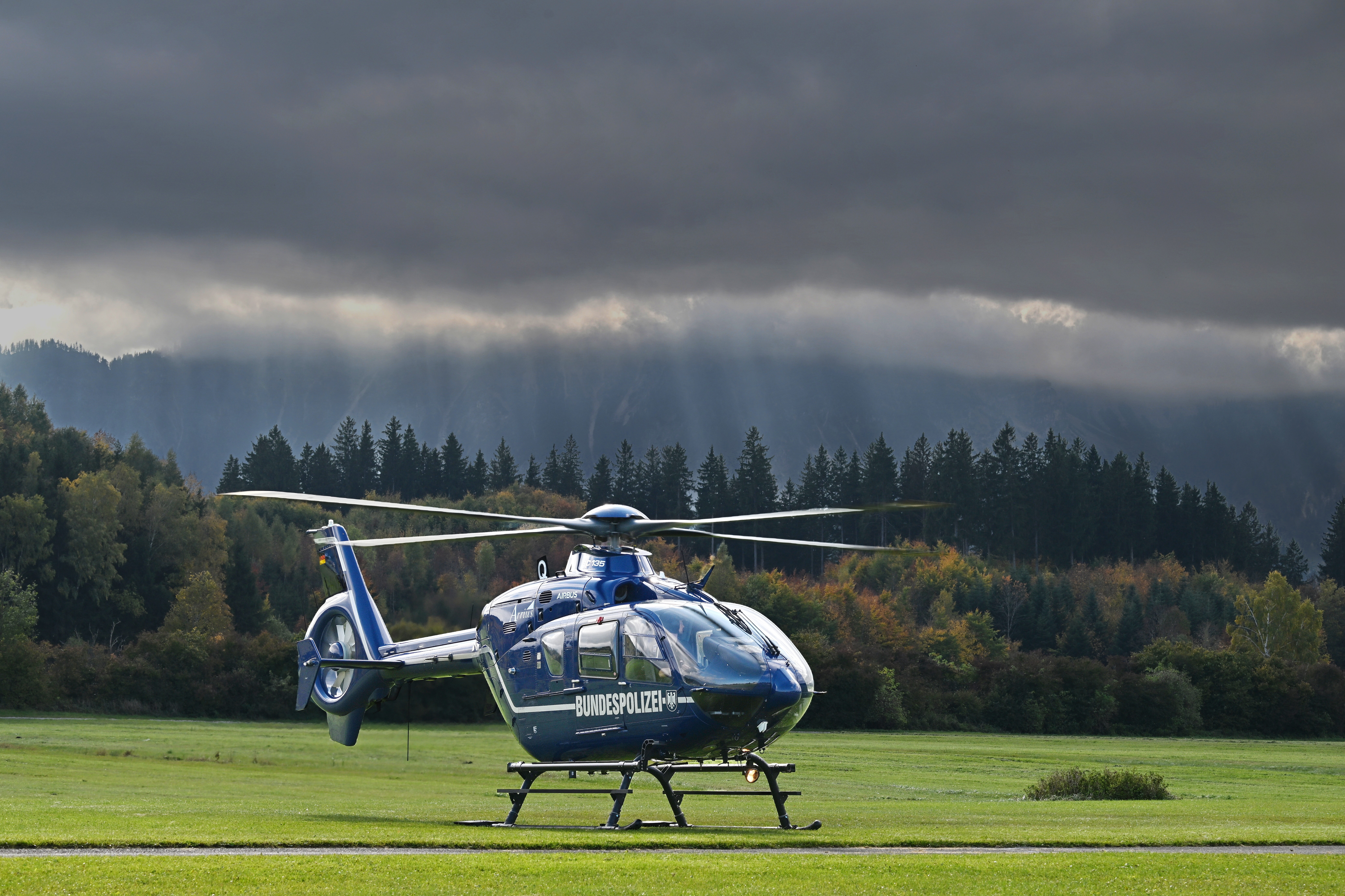 Waiting for the storm to pass before carryng out a new mission for this EC135T2+ of Bundespolizei during the annual police helicopter mountain training in Fussen.