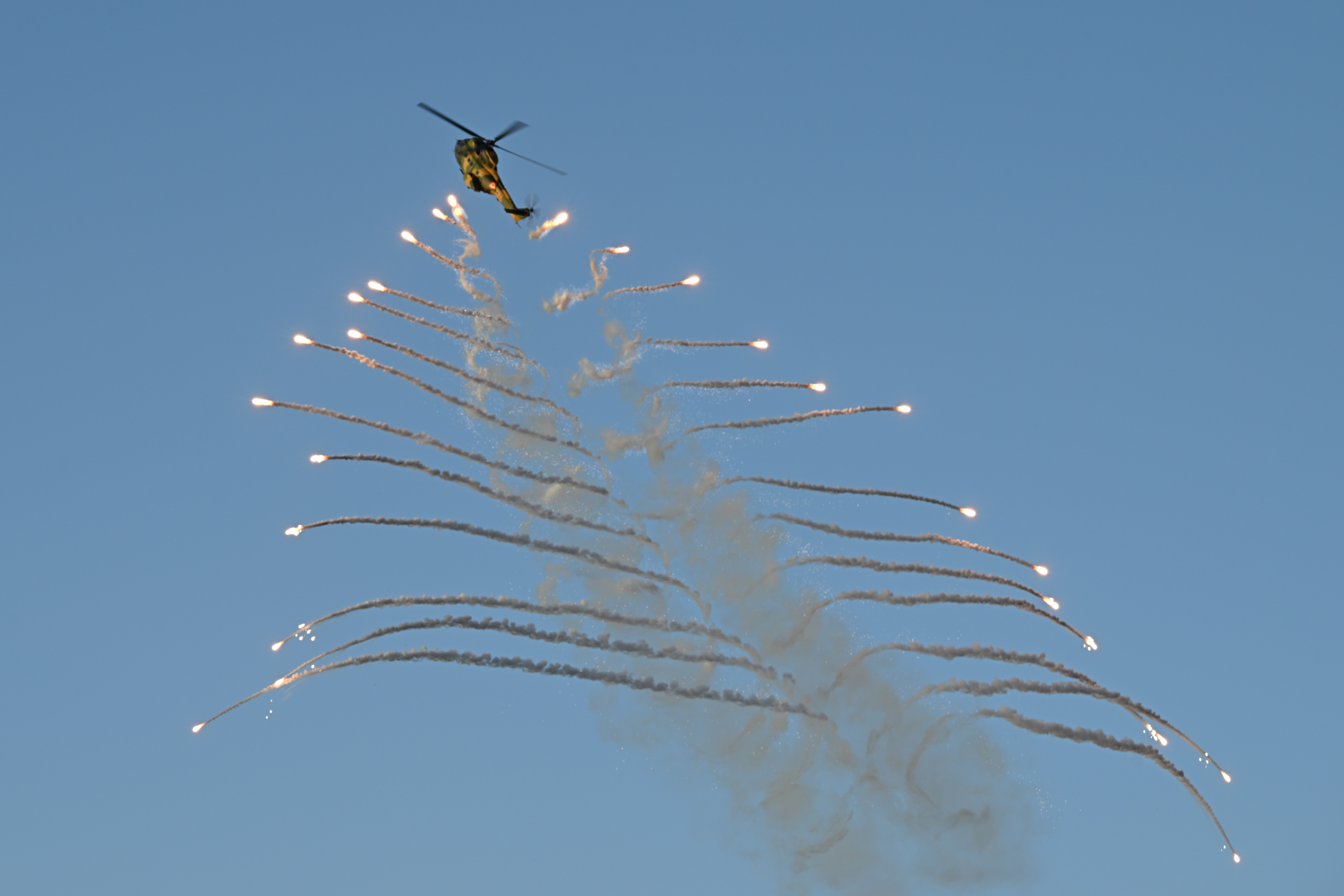"Christmas tree" style launch of flares during the impressive flight demostration of a IAR 330L of Romanian Air Force during the BIAS 2025 exhibition in Bucharest,