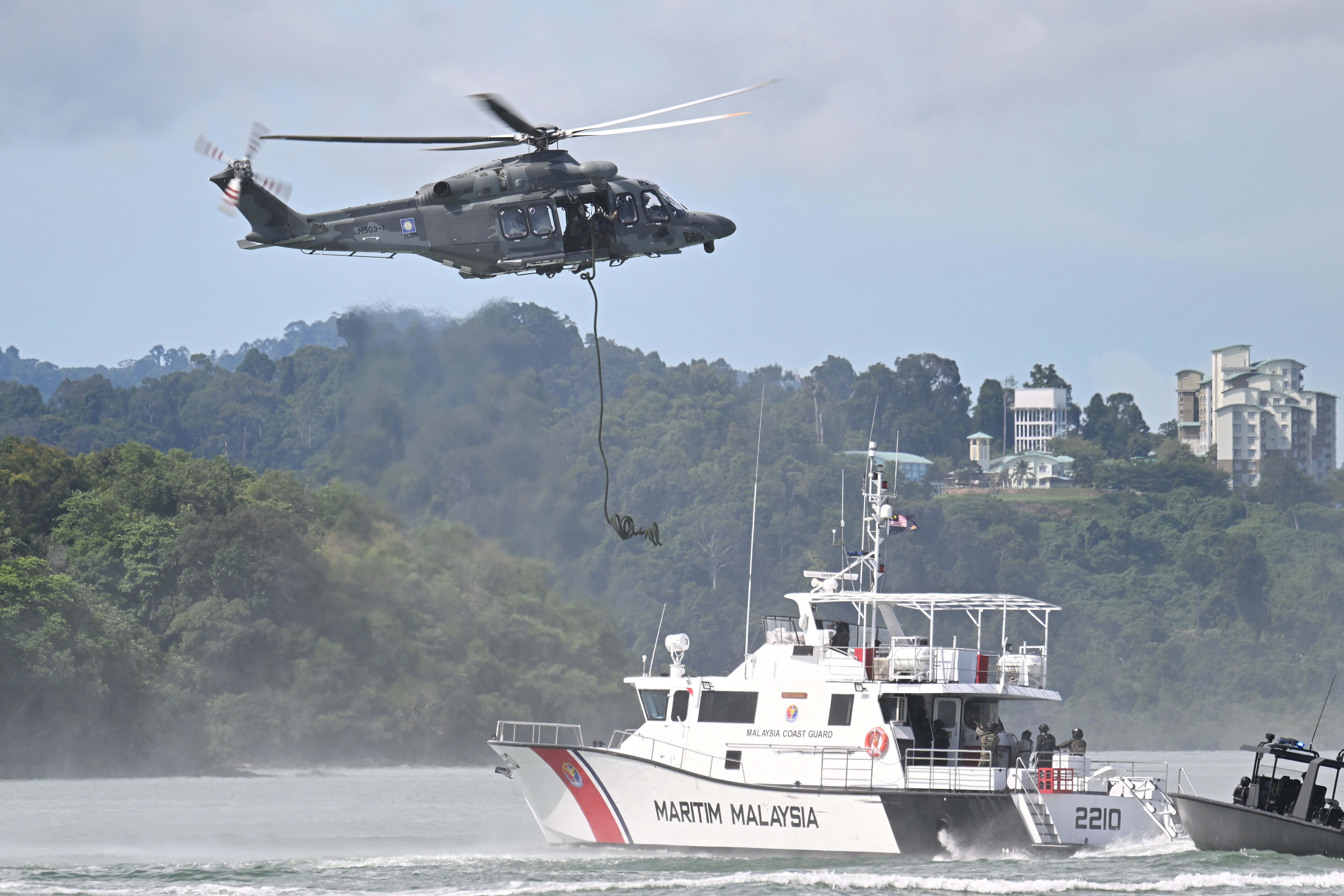 This AW139 M503-1 of TLDM (Malaysian Navy) is demostrating a Fast Rope drop during the maritime display at Langkawi Resort World during LIMA 2025 Aerospace Exhibition