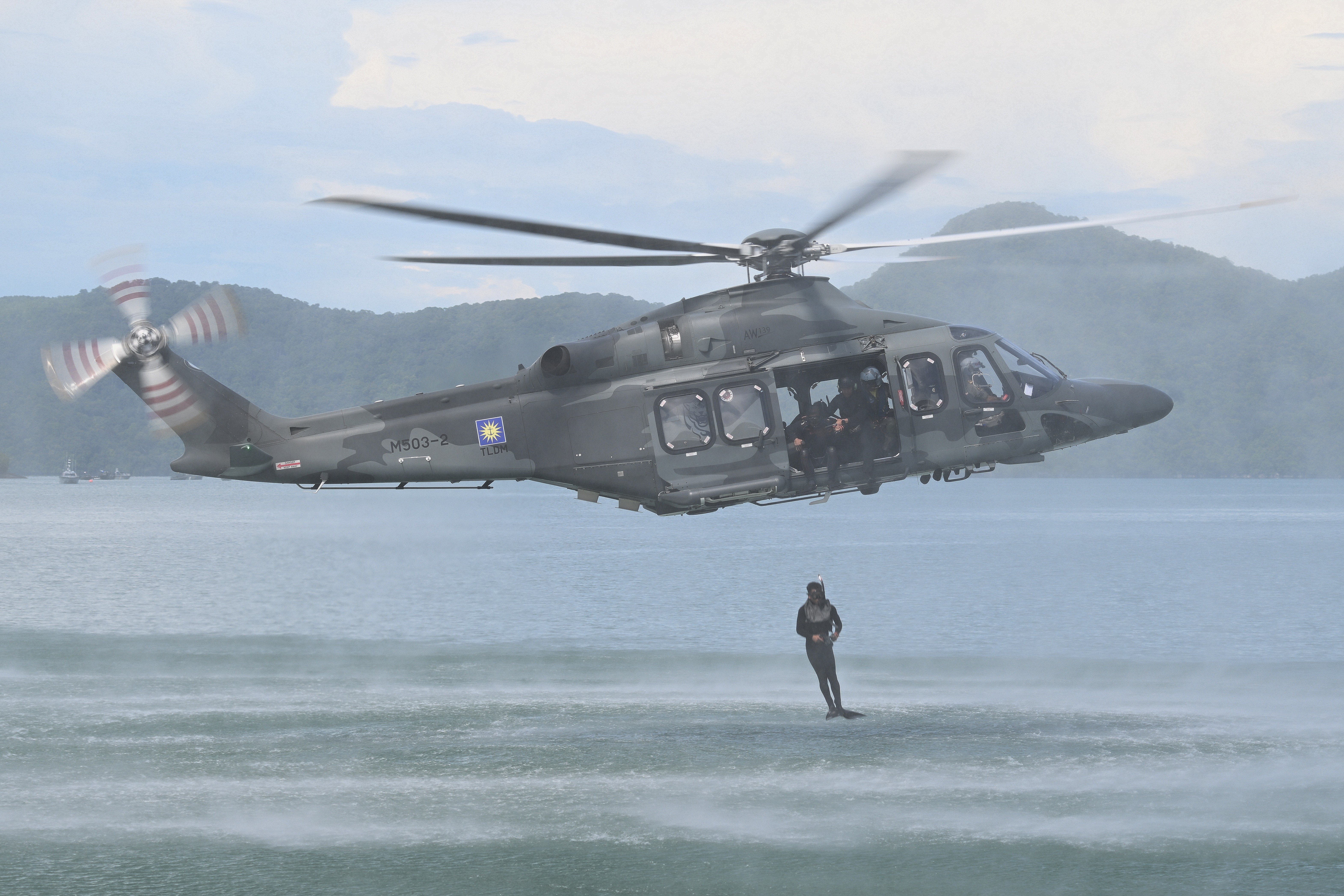 This Aw139  M503-2 of TLDM (Malaysian Navy) is demostrating a scuba diving jump during the maritime display at Langkawi Resort World during LIMA 2025 Aerospace Exhibition