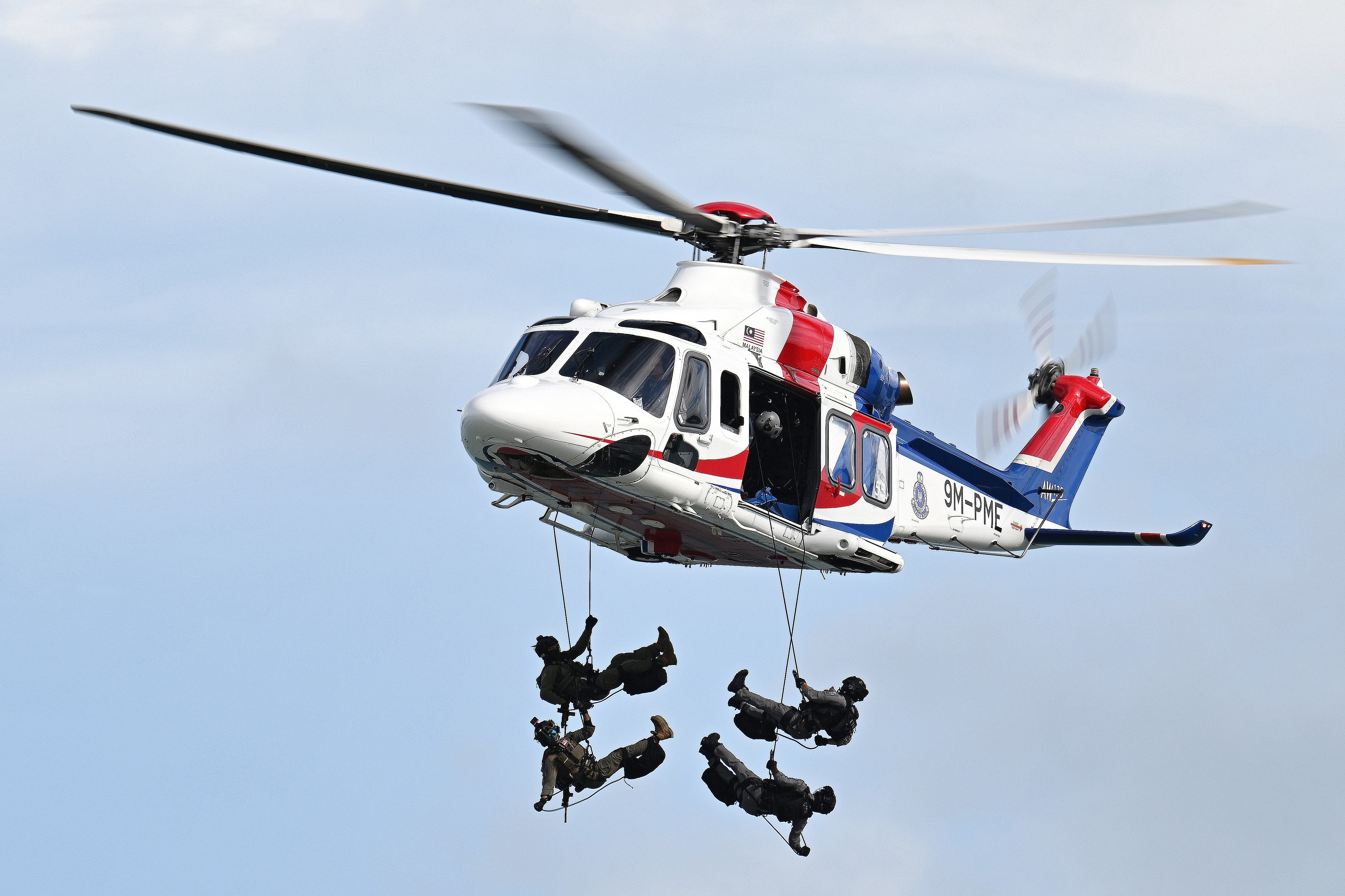 This AW139 9M-PME of Polis Diraja Malaysia is demostrating a special forces dropping during the maritime display at Langkawi Resort World during LIMA 2025 Aerospace Exhibition
