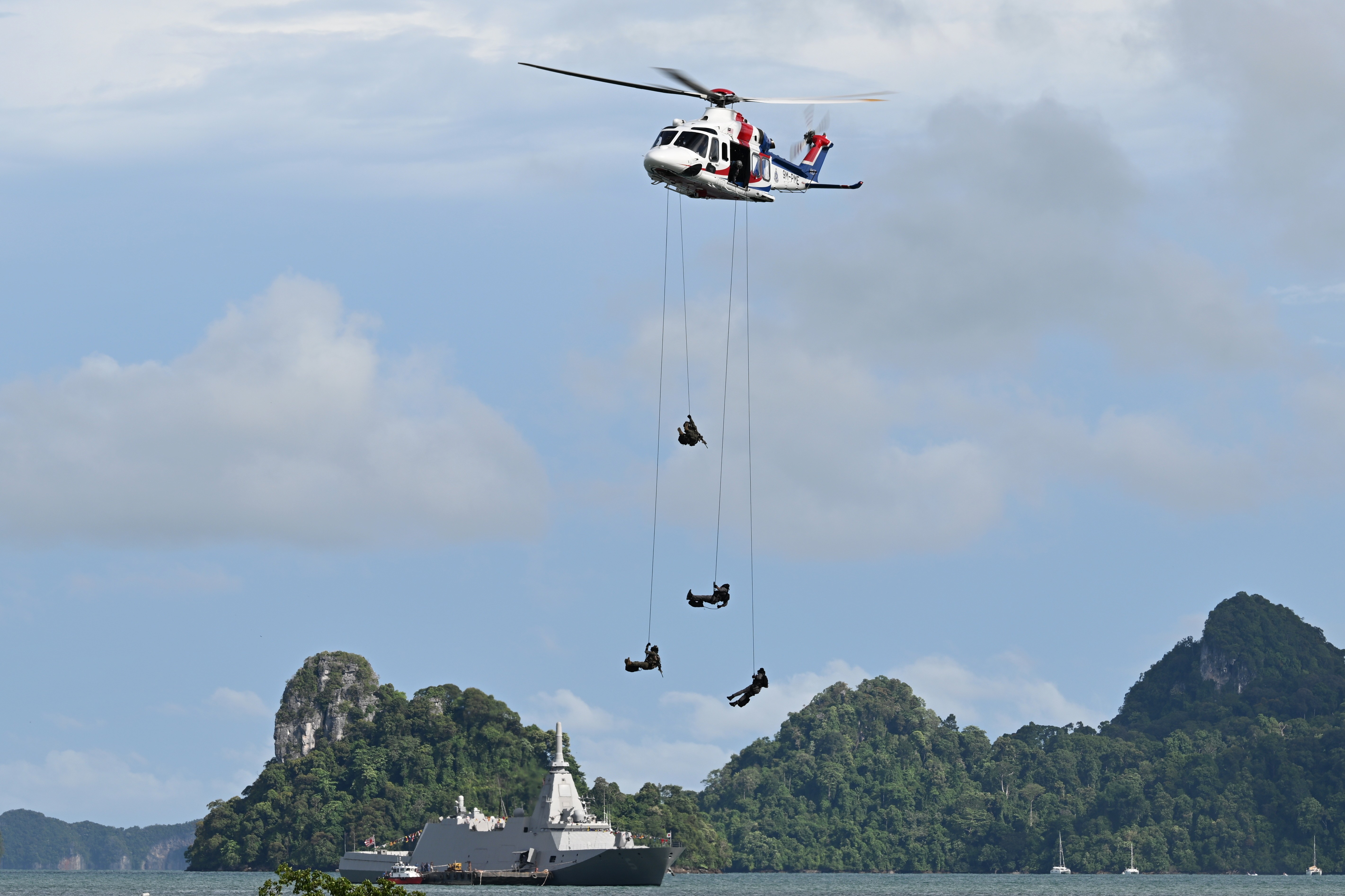 This AW139  9M-PME of Polis Diraja Malaysia is demostrating special forces drop during the maritime counter terrorist display at Langkawi Resort World during LIMA 2025 Aerospace Exhibition